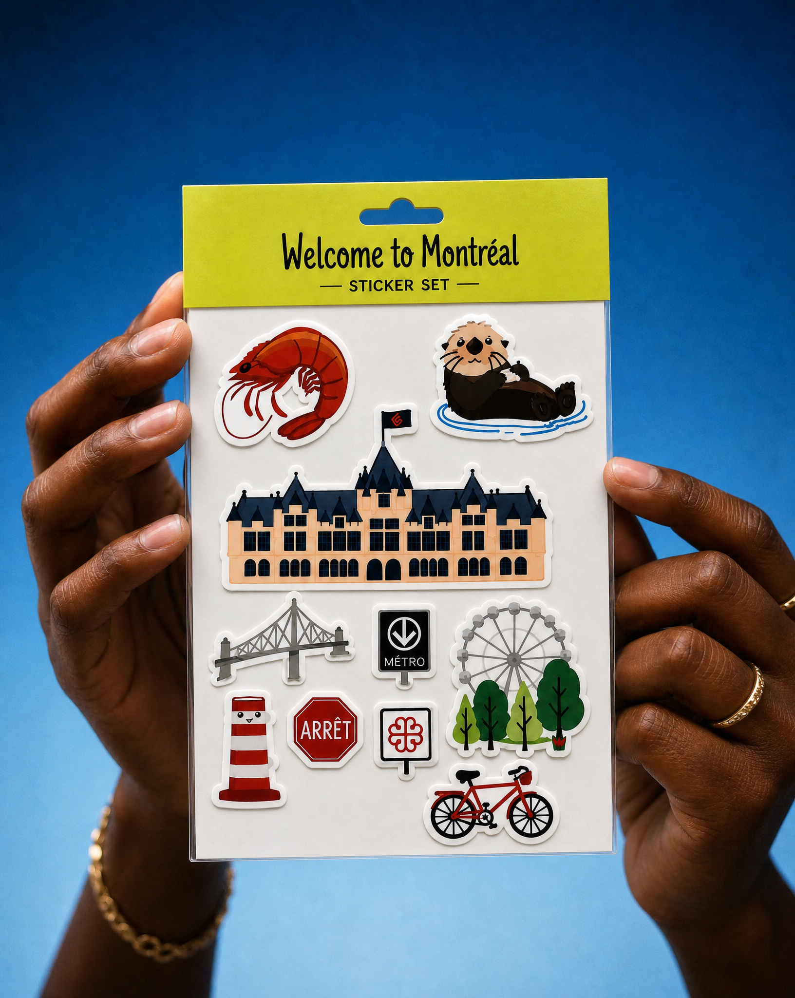 Hands holding the Welcome to Montréal sticker set with the squad shrimp and otter mascots